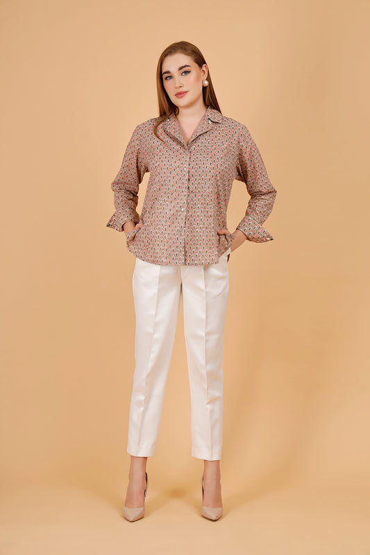 A beautifully blockprinted embellished chic cotton blouse, with white trousers.